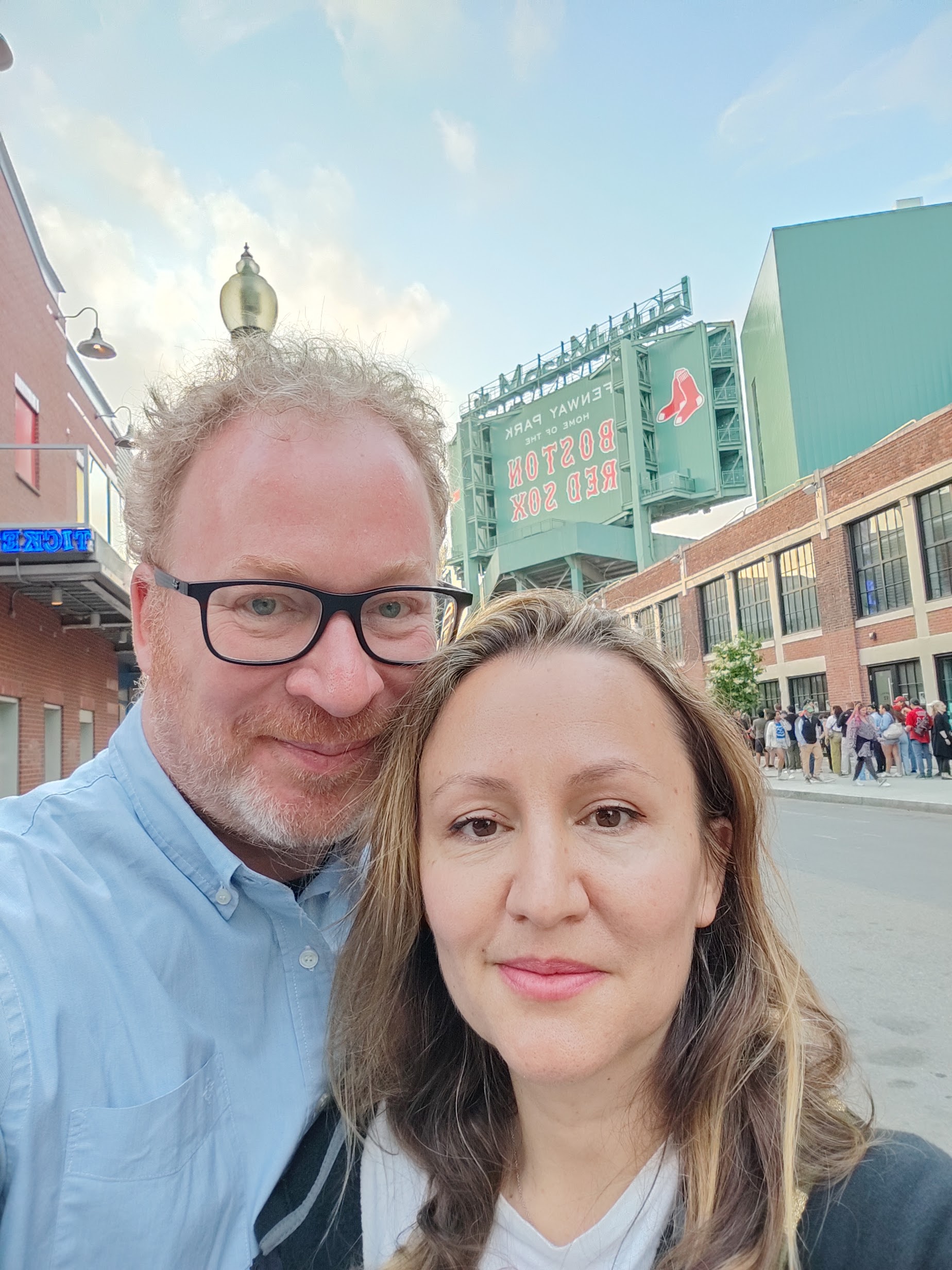 Robert Smithson outside Fenway Park in Boston, with the Boston Red Sox sign visible behind.